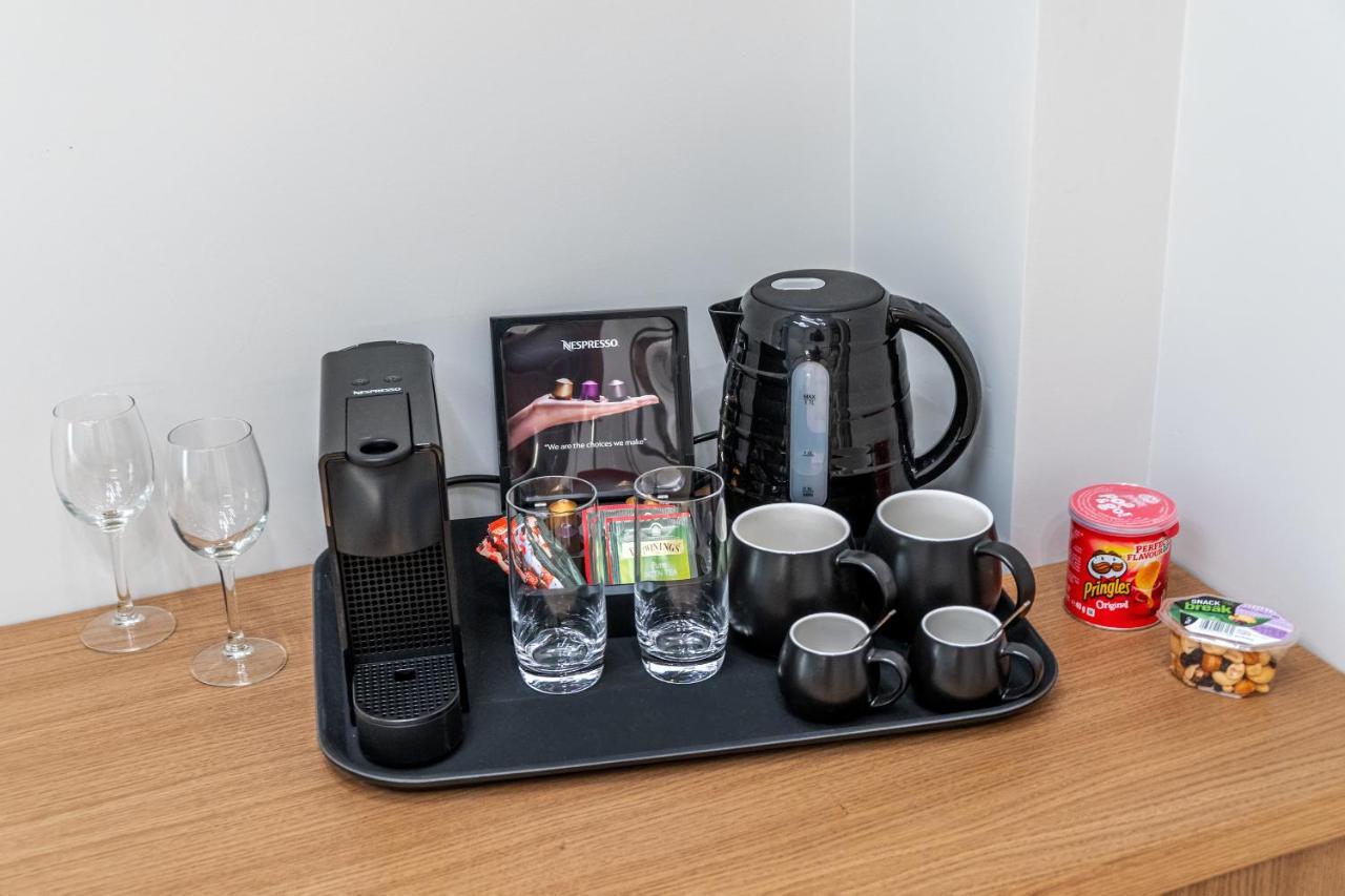 Hellenic Vibes Smart Hotel 雅典 外观 照片 A Nespresso coffee machine in a hotel room